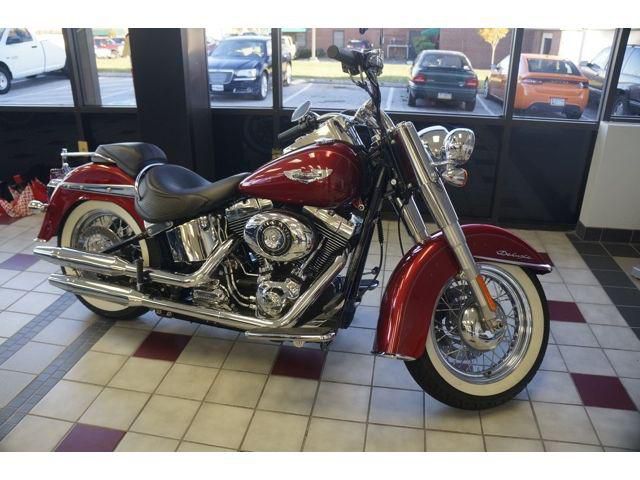 2012 Harley Soft Tail with 316 miles, no modifications, like new, red